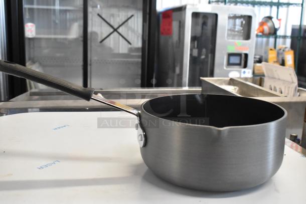 Brand new Thunder Group 922ALSS050AC 5 Qt. anodized non-stick aluminum sauce pan; slight scratches, durable build.