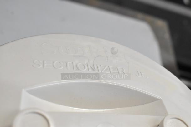 Sunkist Sectionizer Jr. close-up showing brand embossing on white surface, minor scratches visible.