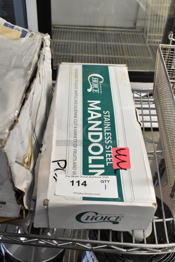 "Brand new Choice stainless steel mandoline, model 407SSMANO, with 5-piece interchangeable blade set, in original box with minor box damage."
