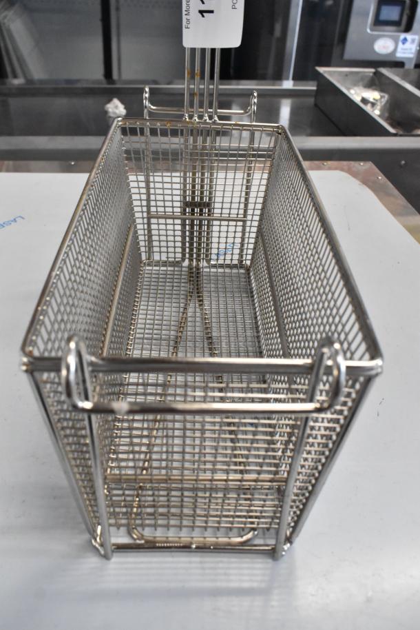 Brand new metal fry basket with mesh design, scratch and dent condition, visible handle, ideal for frying.