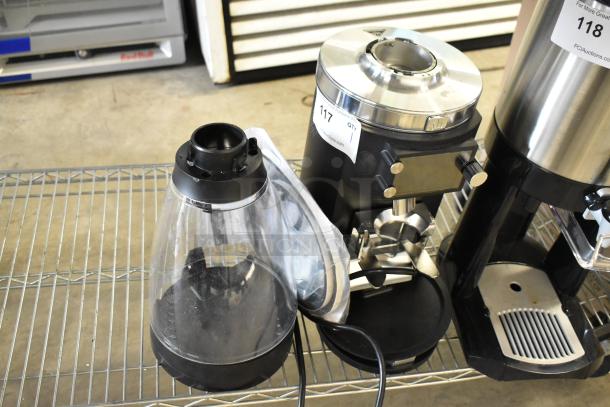 BRAND NEW 2024 Mahlkonig E65W GBS espresso grinder, 2.6 lb. capacity, black, 120V, 1 Phase, showing minor scratches.