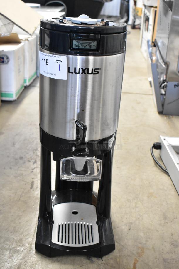 BRAND NEW SCRATCH AND DENT! Fetco Luxus L4D-10, 1-gallon stainless steel coffee server with stand, featuring visible label markings.
