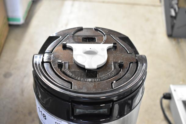 BRAND NEW SCRATCH AND DENT! Fetco Luxus L4D-10, 1-gallon stainless steel coffee server with stand, minor surface marks.