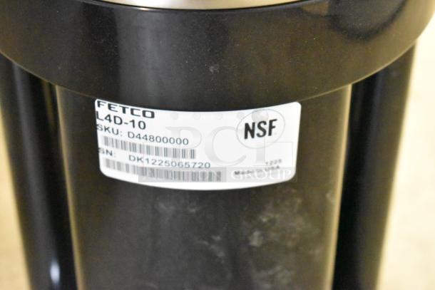 Alt text: Fetco Luxus L4D-10 1 Gallon Stainless Steel Coffee Server with visible label showing NSF certification and SKU D448000000.