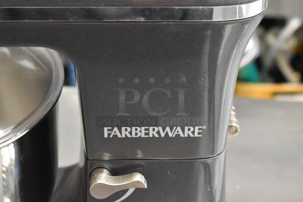 Farberware countertop dough mixer close-up, black with silver accents. Display unit condition. Farberware logo visible.