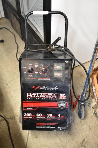 Schumacher SE 8050 Battery Charger, black, features multiple amp settings and engine start, visible controls and cables.