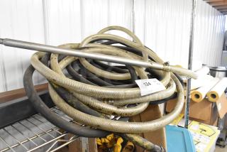 A set of two industrial hoses coiled on a metal shelf, marked with auction lot number 124.