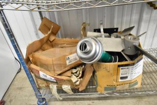 Two boxes containing Prince RD-150-16 and RD522CCAA5A4B1 parts on a metal shelf; labels visible, condition used.