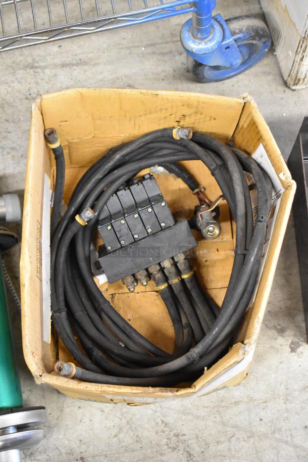 Cardboard box with Prince RD-150-16 parts, including hoses and connectors. Worn condition, suitable for hydraulic systems.