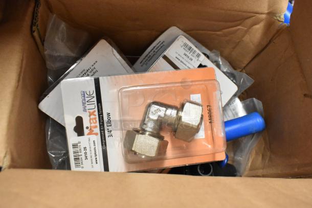Box containing RapidAir MaxLine 3/4" elbow fitting and piping pieces, new in packaging, suitable for air systems.