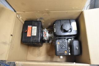 Shurlift 8458127 Hydraulic Power Unit in box, features reservoir, visible labels, appearing unused, ideal for industrial use.