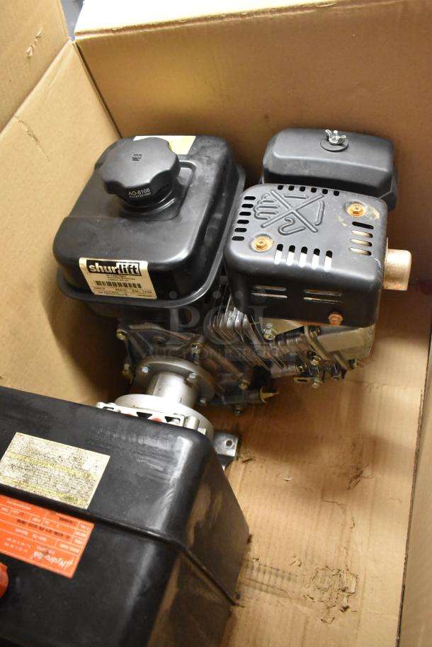 Shurlift 8458127 Hydraulic Power Unit with Reservoir in a cardboard box. Appears in used condition with visible label.