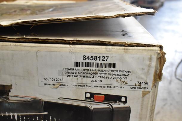 Shurlift 8458127 Hydraulic Power Unit with Reservoir, 7 HP, Subaru engine, label shows model, weight, and contact info.