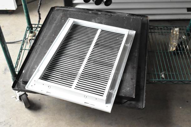 Two-tier lot of stainless steel drop-in bins and metal rods on a cart. Items appear in used condition.