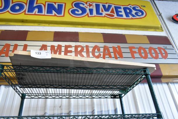 Brand new scratch and dent wood-pattern under shelf, metal frame, item tag "133 QTY 1" visible, in excellent condition.