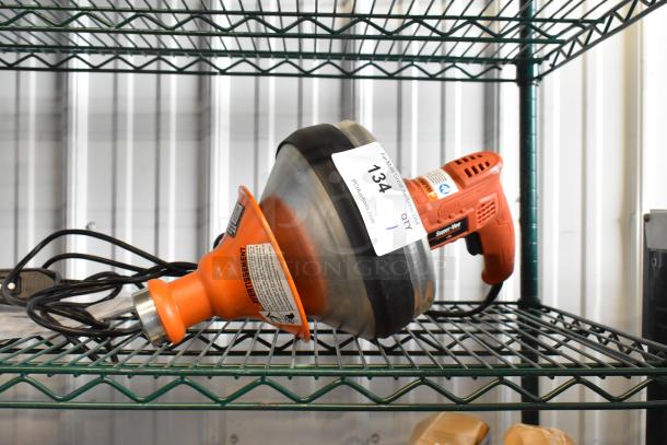 Brand new General NSV1A0579 pipe cleaner, orange and black, with minor scratches and dents. Auction label visible.