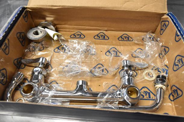 Brand new T&S faucet in original box, chrome finish, slight scratches, with installation components in plastic wrapping.