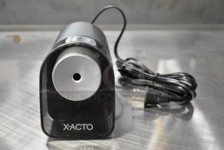 BRAND NEW X-acto 1818XX countertop electric pencil sharpener, 120V, 1 phase, black, minor scratches, cord included.