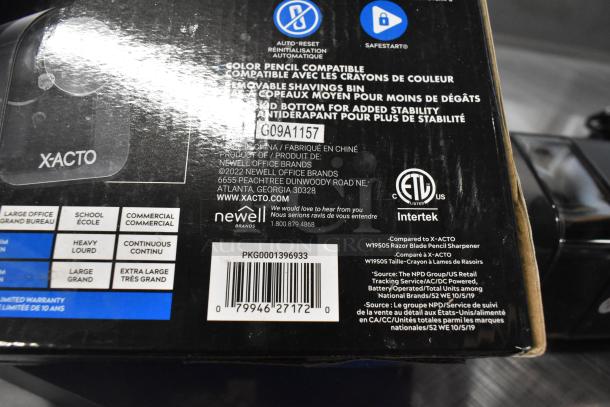 Brand new X-acto 1818XX electric pencil sharpener, 120V, 1 Phase, with scratch and dent. Box shows model details and brand labels.