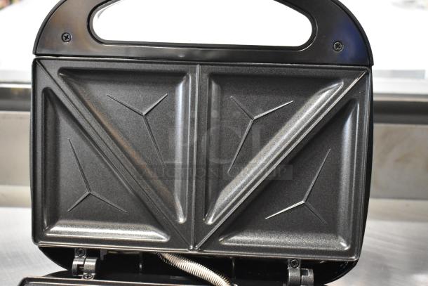 Brand new ABS07-T countertop sandwich maker, 120 volts, 1 phase, with minor scratches and dents.