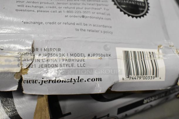 Damaged packaging of Jerdon JP7506BK 8" round black 2-sided wall-mount mirror. Visible barcode and model details.