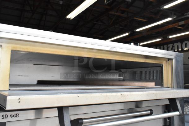 Marsal & Sons SD448 stainless steel natural gas pizza oven with cooking stones, 95,000 BTU, model visible, commercial use.