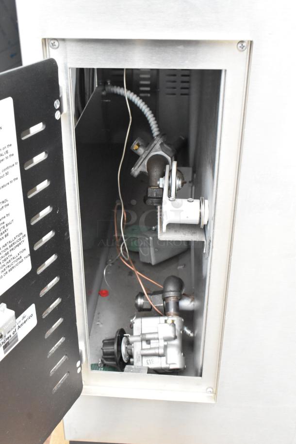 Marsal & Sons SD448 pizza oven interior, showing stainless steel casing, gas connections, and control components.