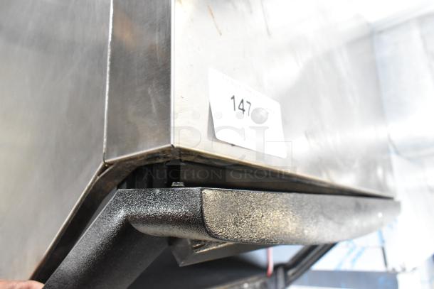 Manitowoc QY0134A stainless steel undercounter ice machine, commercial-grade, visible label "147", good condition.