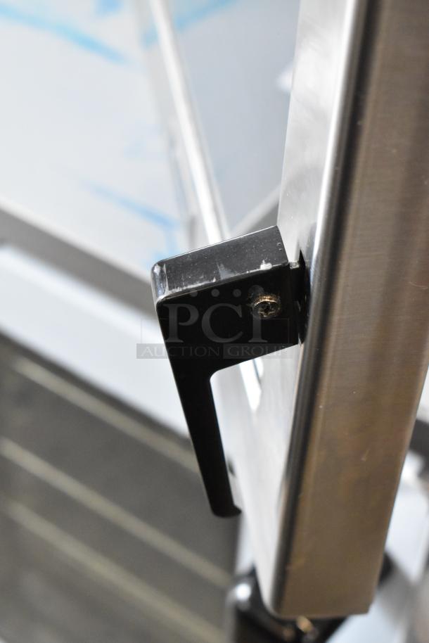 2021 Amana RC30S2 stainless steel commercial microwave handle detail, showing sturdy build and modern finish.