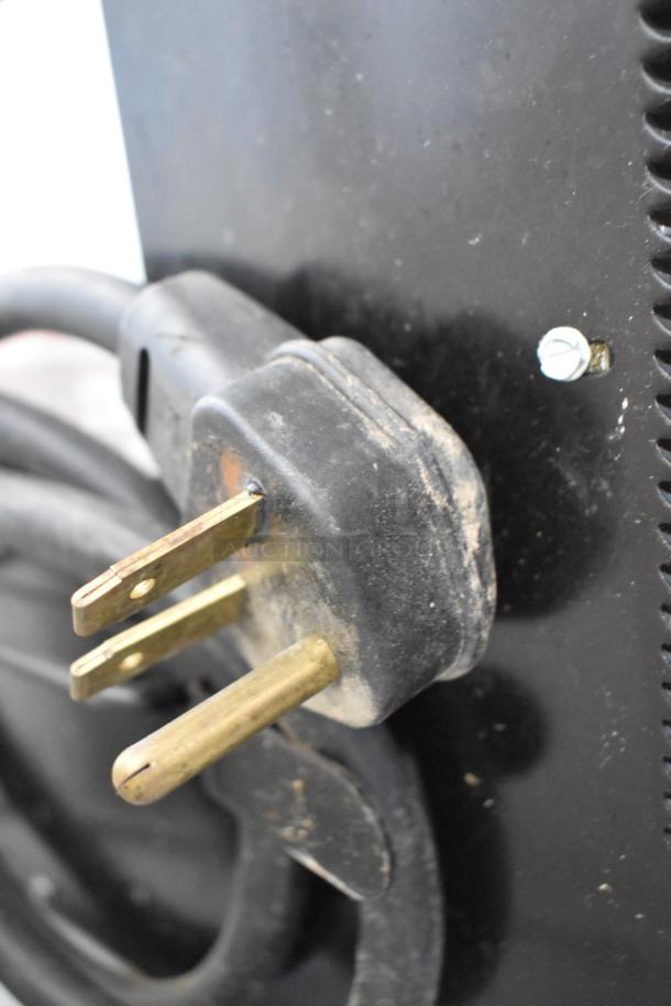 2018 Menumaster MRC30S2 microwave power plug, 208/240V, showing wear; suitable for commercial use.