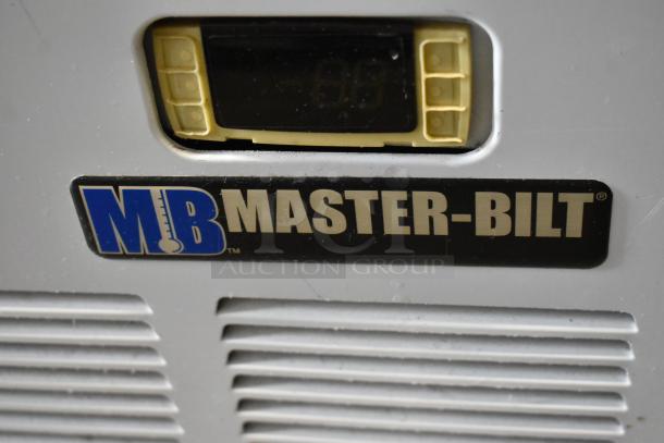 Master-Bilt BLG-48HD freezer label, showing brand and digital display. Metal surface, commercial-grade condition.