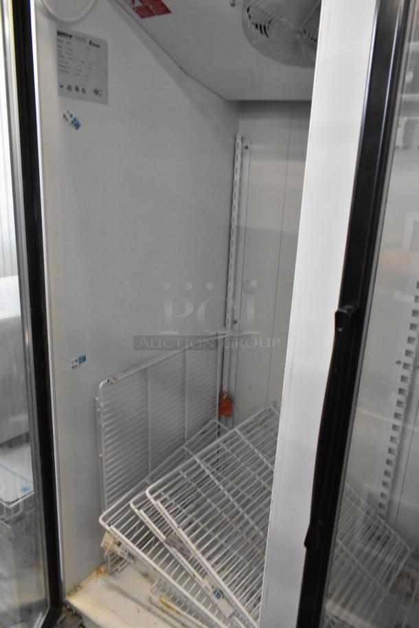 Master-Bilt BLG-48HD commercial freezer, two-door reach-in, metal, visible shelves, 115/208-230 volts, label shown.