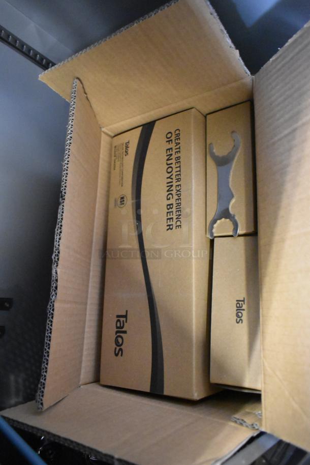 Brown cardboard box with "Talos" branding, containing components for a commercial kegerator. Text reads "Create Better Experience of Enjoying Beer."
