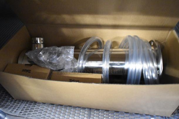 Brand new metal commercial kegerator parts in box, showing tubes and fittings. 115 Volts, 1 Phase, scratch and dent condition.