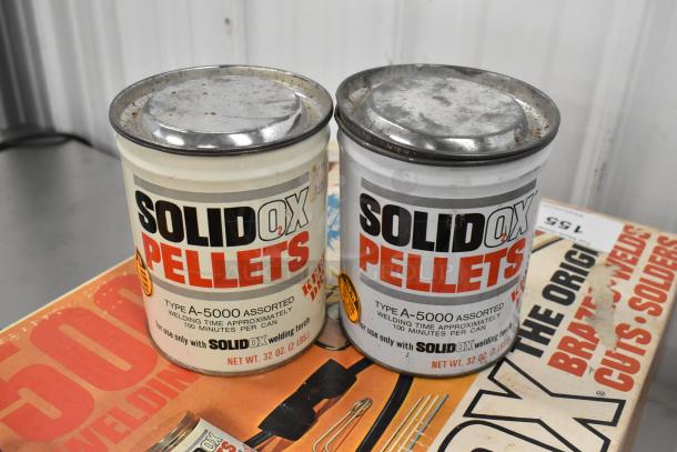 Sears 5000 Welding Torch set with two SolidOx Pellets cans. Each can holds 32 oz, indicating 100 minutes of welding time.