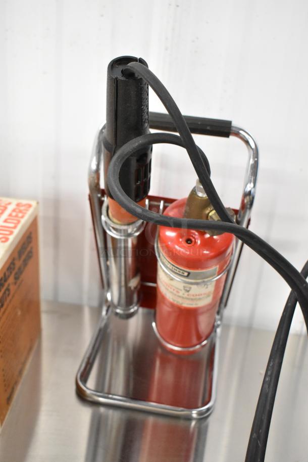 Sears 5000 Welding Torch, red canister, black handle, chrome stand, visible label, excellent condition, minimal wear.