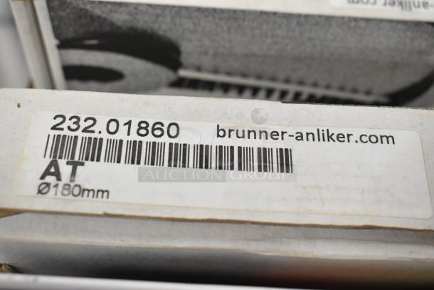 11 new Brunner Anliker food processor blades, model 232.01860, Ø180mm, in original packaging.