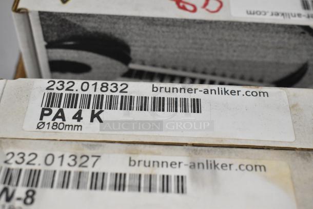 11 brand new Brunner Anliker food processor blades, model PA4 K, 180mm diameter, in original packaging.