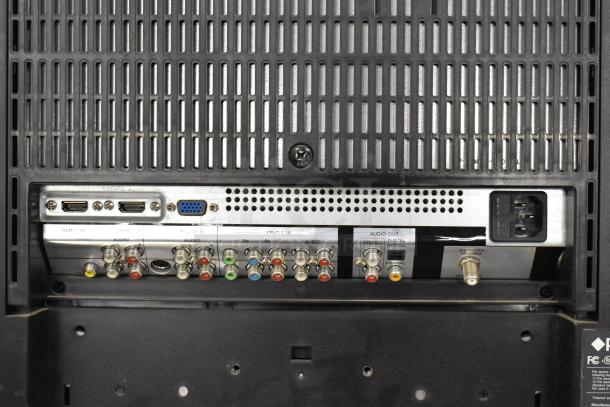 Polaroid 3211-TLXB TV back panel, showing HDMI, VGA, and various audio/video inputs. 100-240V, local pickup required.