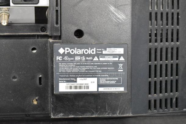 Polaroid 3211-TLXB TV, 100-240V, July 2007. Model/serial numbers displayed. Buyer pickup only; no shipping.