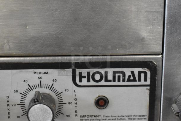 Holman stainless steel commercial countertop conveyor toaster oven, features dial control and branding. 115 volts, 1 phase.