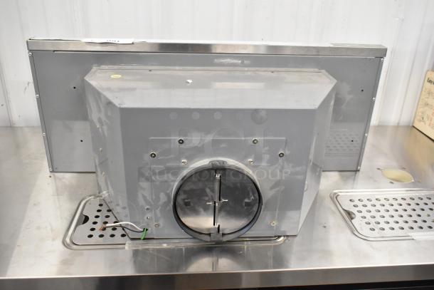ZPI-E30AG290 metal range hood; gray finish, ventilation opening, stainless steel, screws visible; good condition.