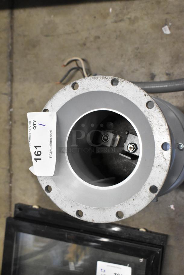 Hobart FD4/125-2 commercial garbage disposer, 1 1/4 hp, 208-240/480V, long upper housing, visible tag with auction info.