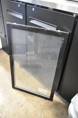 Two glass merchandiser doors with black frames, minimal wear, ideal for commercial display use.