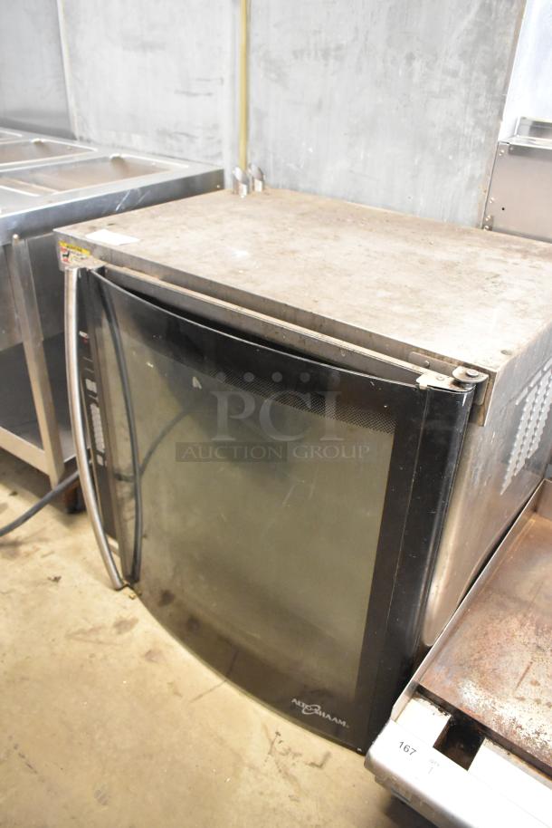 Alto Shaam AR-7E stainless steel electric rotisserie oven, visible wear, front glass door, interior racks, model label.