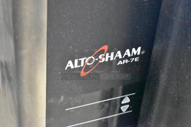 Alto Shaam AR-7E stainless steel commercial electric rotisserie oven with visible branding.