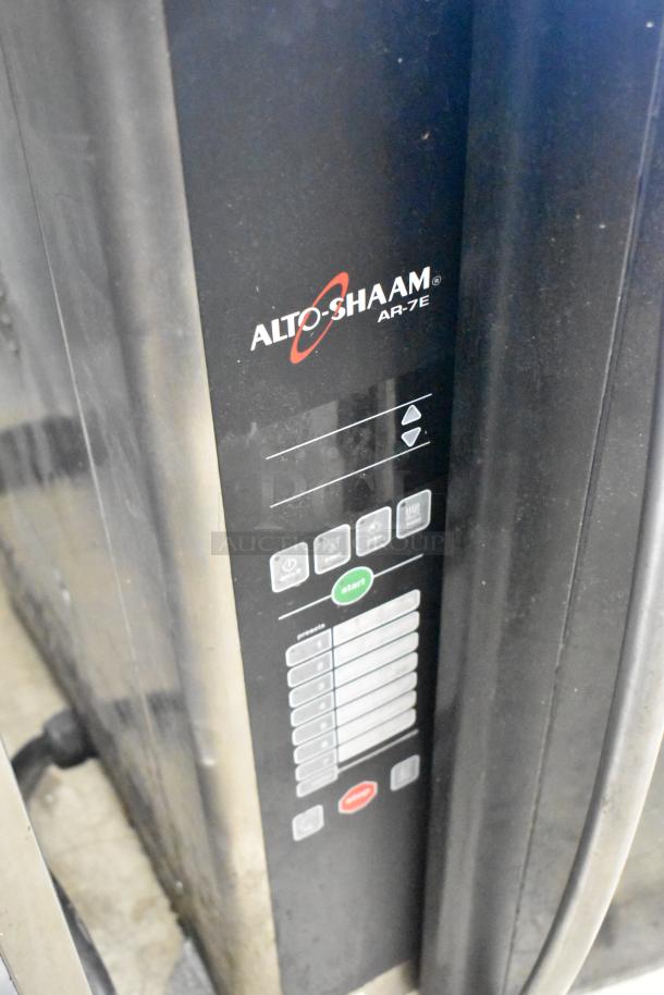 Alto Shaam AR-7E stainless steel electric rotisserie oven. Features control panel, brand markings, well-maintained condition.