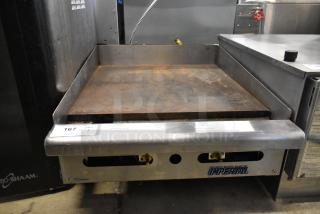 Imperial ITS-24 stainless steel natural gas flat top griddle, used condition, visible controls, and Imperial branding.