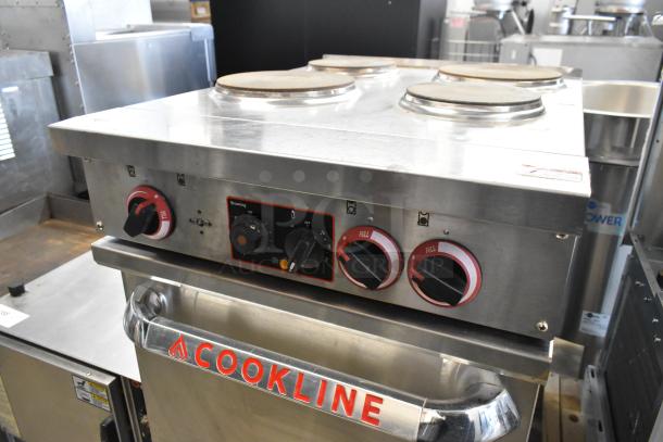 Cookline Stainless Steel 4-Burner Electric Hot Plate Range with Oven, in good condition. Features red dials and branding.