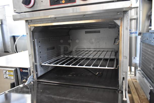 Cookline stainless steel 4-burner electric hot plate range with oven. Used condition, visible interior and control knobs.